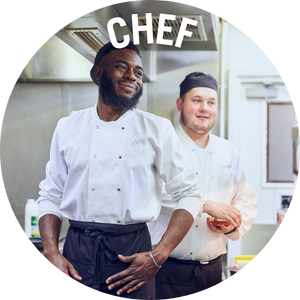 Two chefs in whites stand in kitchen. Banner reads 'chef'
